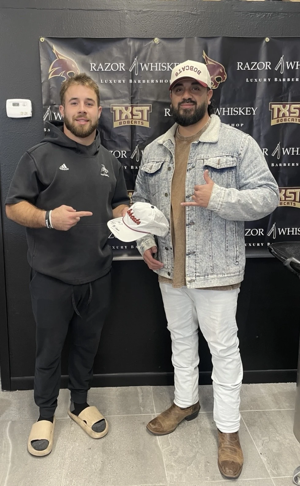 Real photo of Q with former Texas State Bobcat Lincoln Pare