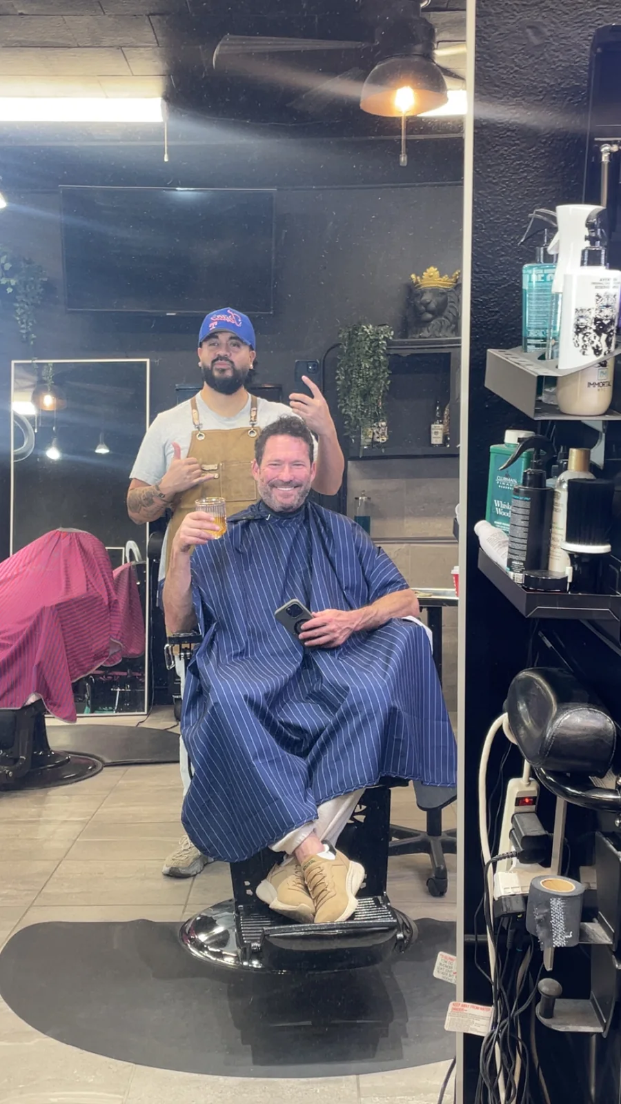 Q with a client at Razor & Whiskey Barbershop